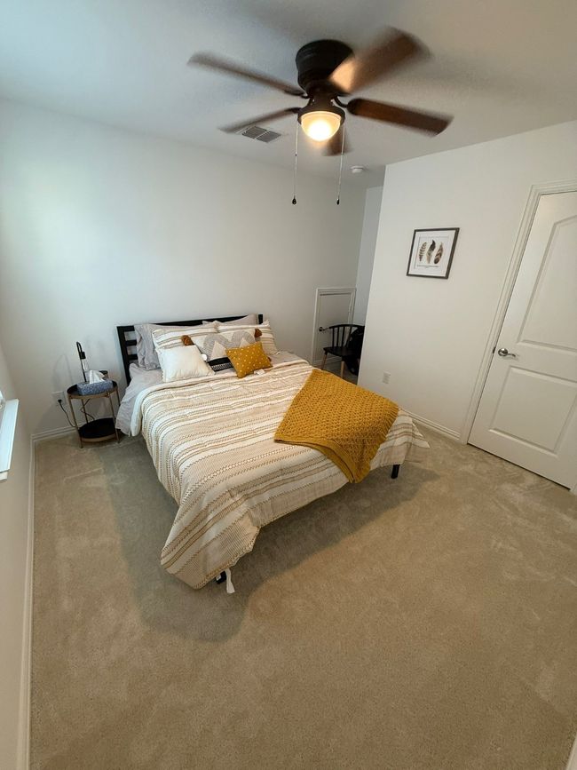 Bedroom featuring carpet and a ceiling fan | Image 11