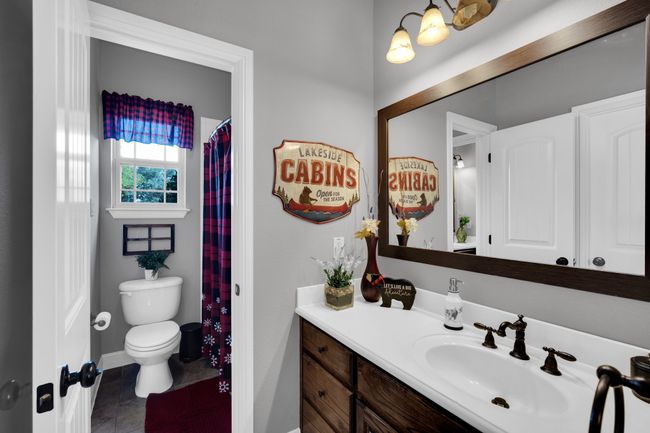 Bathroom featuring tile patterned floors, vanity, and toilet | Image 24