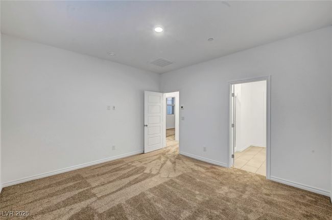 Unfurnished bedroom featuring light colored carpet, visible vents, recessed lighting, and baseboards | Image 32