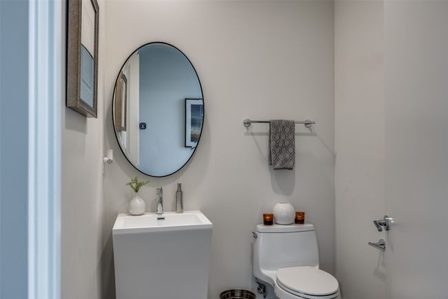 Bathroom with toilet and a sink | Image 32