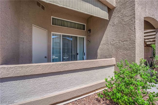 Entrance to property featuring a balcony and stucco siding | Image 36