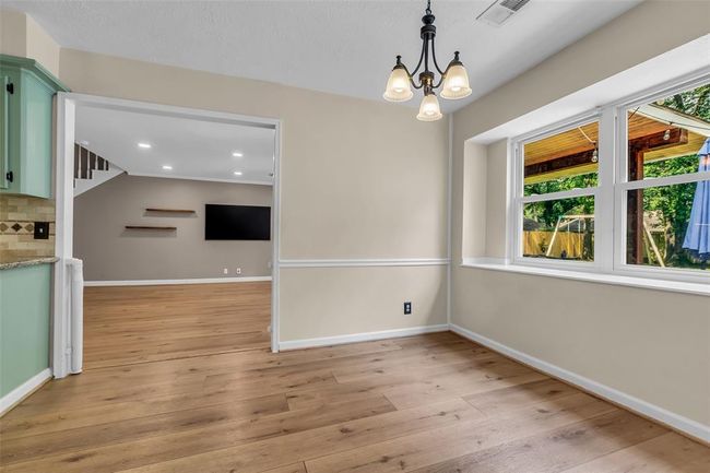 Another view from the breakfast room into the living room. | Image 16