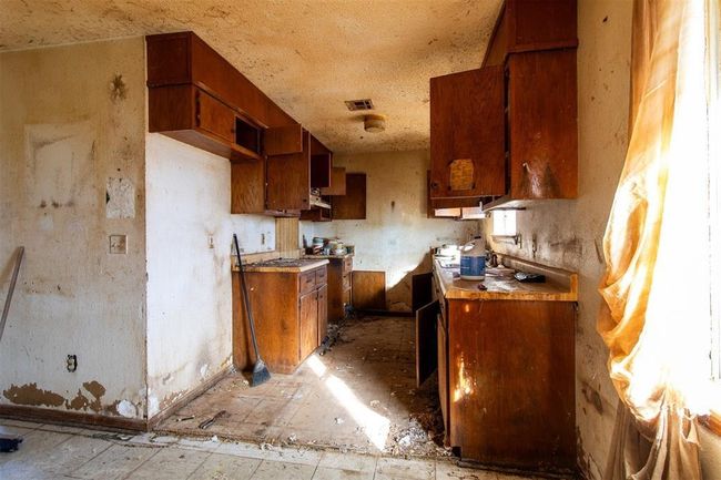 Kitchen with brown cabinetry | Image 5