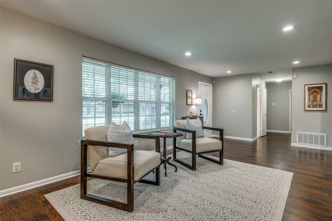Living area with recessed lighting and wood finished floors | Image 7