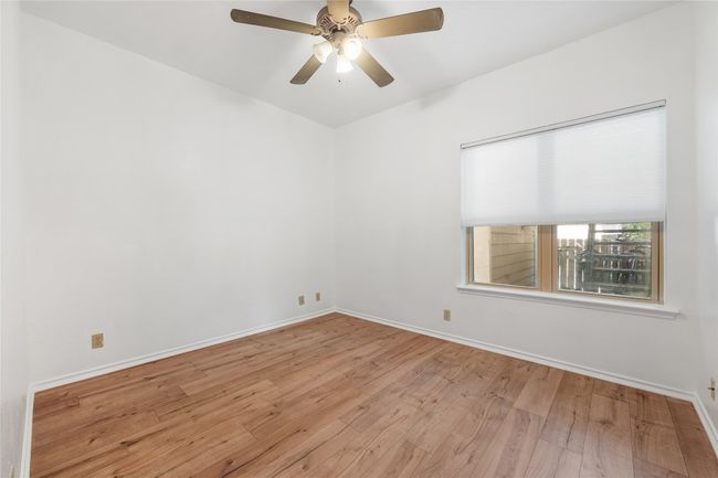 Unfurnished room featuring wood-type flooring and ceiling fan | Image 26