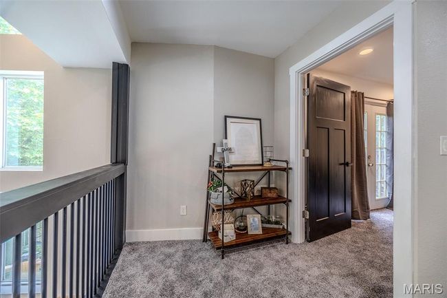 Hall featuring carpet and baseboards | Image 35