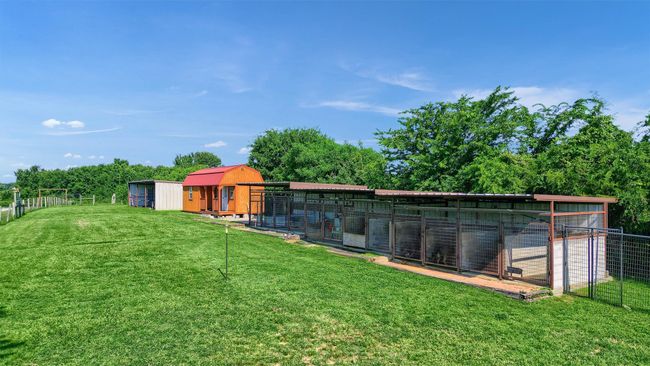 View of yard featuring fence and an outdoor structure | Image 9