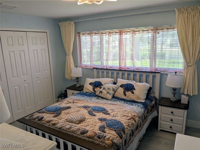 Bedroom featuring visible vents, a closet, and wood finished floors | Image 26