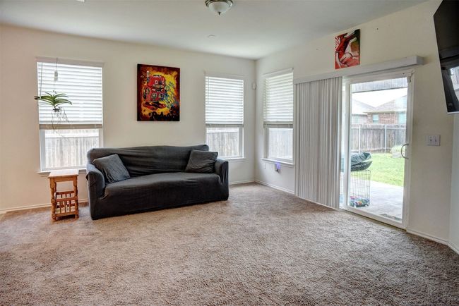 Living room featuring carpet floors and plenty of natural light | Image 16