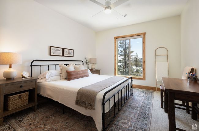 Bedroom featuring baseboards, wood finished floors, and a ceiling fan | Image 19