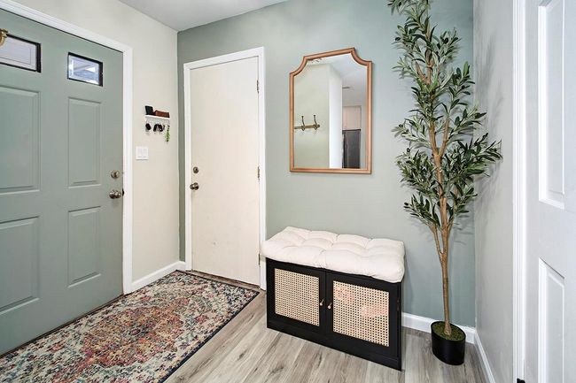 Entrance foyer with wood finished floors and baseboards | Image 4