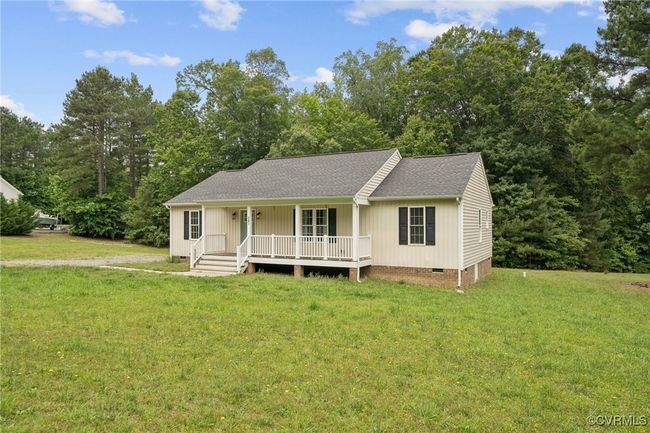 View of front of home with crawl space, covered porch, roof with shingles, and a front lawn | Image 29