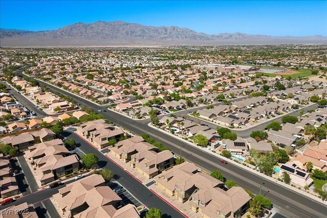 Aerial view of residential area featuring a mountain backdrop | Image 48