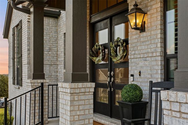 Guests are greeted by stunning double glass front doors and large entryway | Image 4