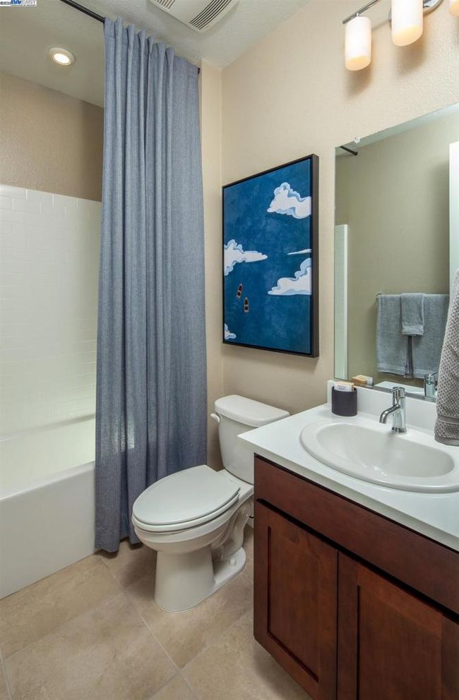 Photo is of the model home and not the actual home for sale. | Image 17