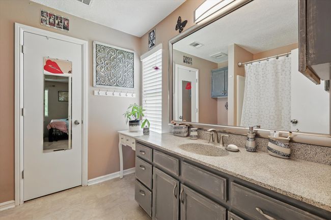 Full bath with baseboards, vanity, and visible vents | Image 22