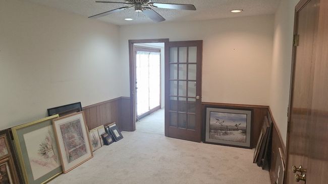 Office featuring a wainscoted wall, carpet, and a textured ceiling | Image 9