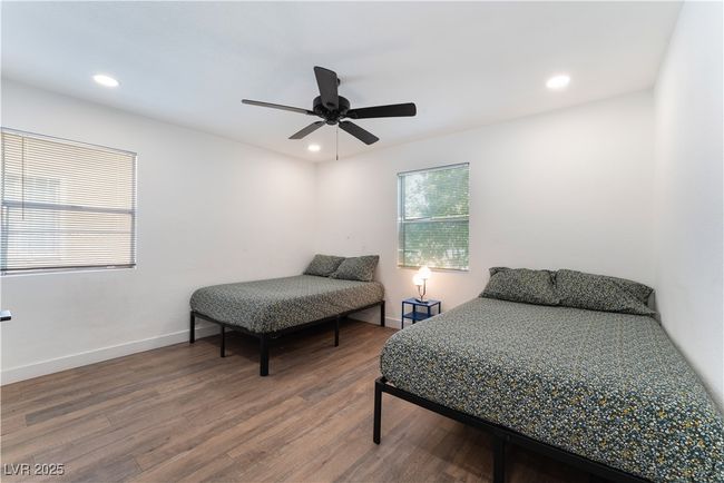 Bedroom featuring recessed lighting, baseboards, ceiling fan, and wood finished floors | Image 25