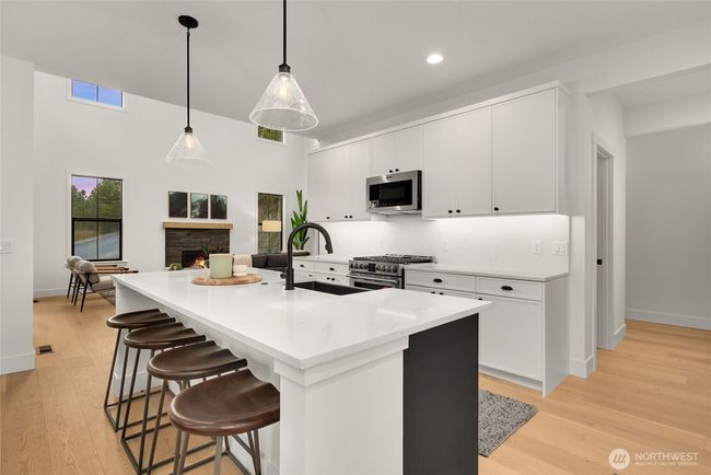 As the newest PNW master-planned community, enjoy 200+ acres of open space, trails & the Coal Trax Mt Bike Park. Soaring ceilings in the great roommake each day worthy of celebration & open floorplan appeals to entertaining. Covered deck & patio. Southern-facing homesites range from the mid600s- 900ks. Enjoy a variety of innovative & distinctive new home options with the best all-season recreation just moments away! Built for the future, indulge in a retreat just 90-min to Seattle. Plans and elevations are artist’s renderings only, may not accurately represent the actual condition of a home asconstructed and may also contain options and upgrades which are not included in the sale. Trailside Homes reserves the right to make changes to the floorplan, specifications, dimensions, design and elevations without prior notice. Stated dimensions and square footage are estimated and should not be usedas representations of the home’s actual size. | Image 15
