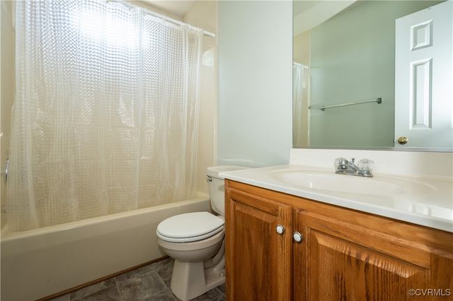 Bathroom featuring shower / tub combo and vanity | Image 15