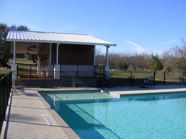 Pool, patio, and cabana with kiddie wading area | Image 13