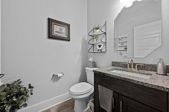 Downstairs powder room with full cabinet. | Image 29