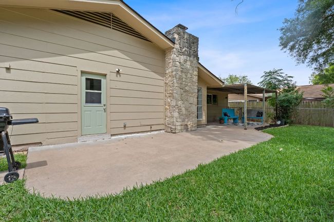 Back of house with a patio and a chimney | Image 34