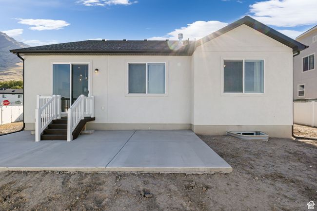 Back of property featuring a patio area, fence, and stucco siding | Image 9