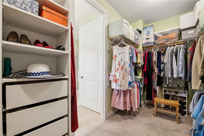 Primary walk-in closet (left side). More adjustable shelving, drawers, and upper, lower, and full length clothing rods. | Image 23