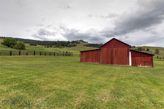 View of yard featuring an outbuilding and a rural view | Image 28