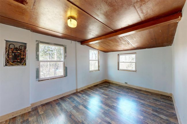 Bonus room with hardwood / wood-style floors, wood ceiling, baseboards, and lofted ceiling with beams | Image 10