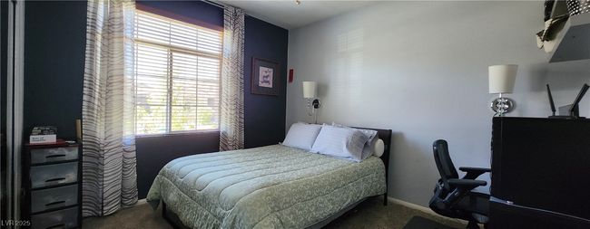 Carpeted bedroom featuring baseboards | Image 13