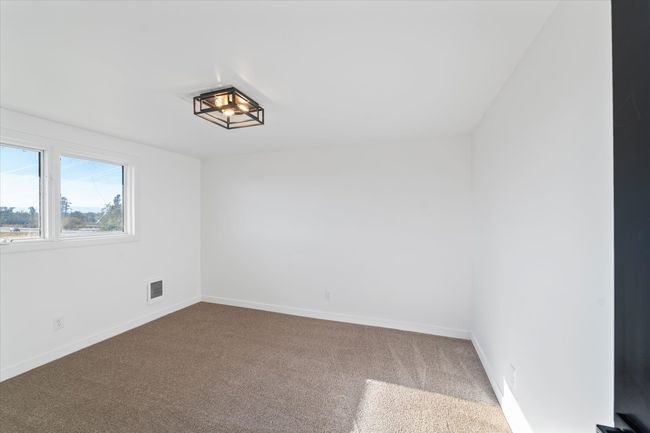 Spare room featuring carpet floors | Image 33