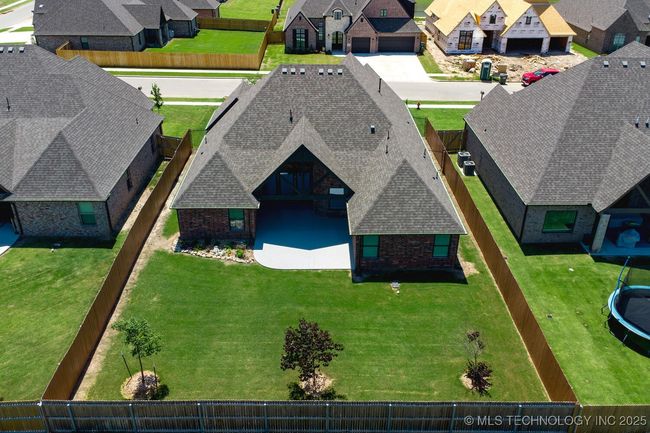 Fully Fenced back yard with trees and landscape. | Image 43