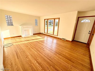 Living room featuring light hardwood / wood-style flooring and plenty of natural light | Image 2