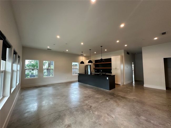 Unfurnished living room featuring finished concrete floors and recessed lighting | Image 20