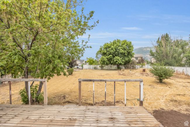 Wooden terrace featuring a mountain view and fence | Image 28
