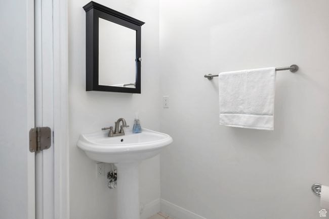 Bathroom featuring baseboards and a sink | Image 27
