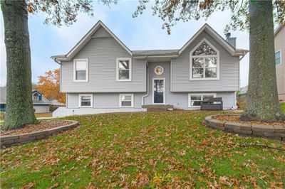 Split foyer home featuring a front lawn | Image 1