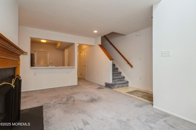 Stairs heading to the 2nd floor with Primary Bedroom | Image 15