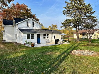 Back view of home with firepit patio and grassy yard.jpg | Image 2