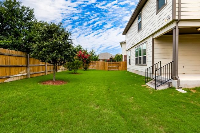 View of yard with entry steps | Image 34