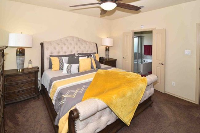 Bedroom with carpet flooring and a ceiling fan | Image 16