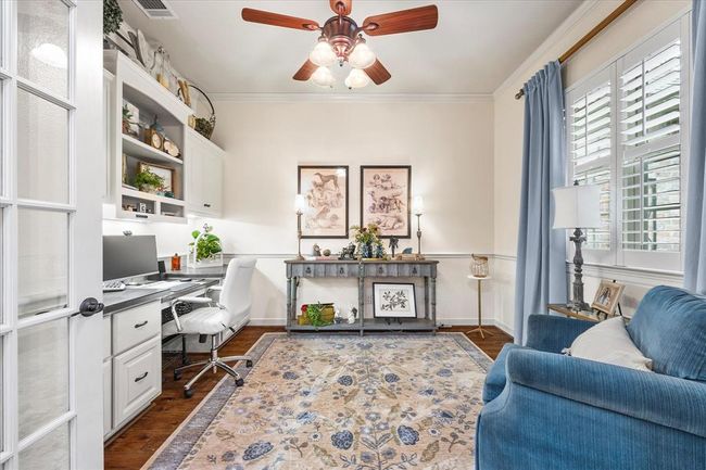 Office featuring ceiling fan, dark wood-type flooring, and ornamental molding | Image 13