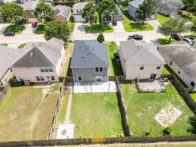 Fully fenced backyard provides privacy and security, ideal for kids, pets, and outdoor enjoyment. | Image 35