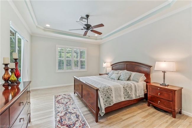 Main bedroom with a tray ceiling. | Image 15