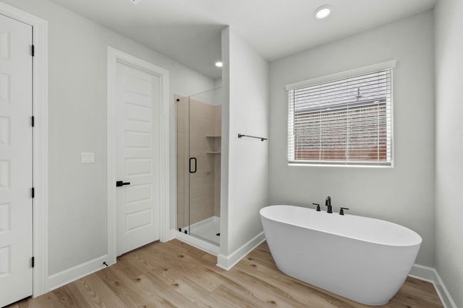 Relax in the large soaking tub or enjoy the spacious, standing shower. | Image 5