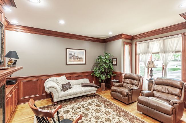 The first-floor library is perfect for a home office. | Image 28