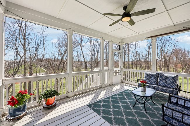The screened in porch is off the kitchen. | Image 29