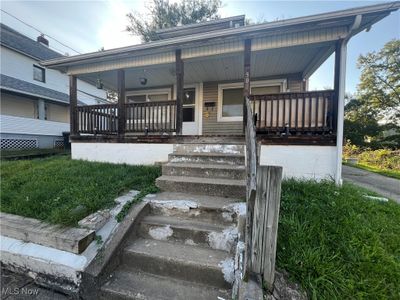 Bungalow-style house featuring covered porch | Image 1